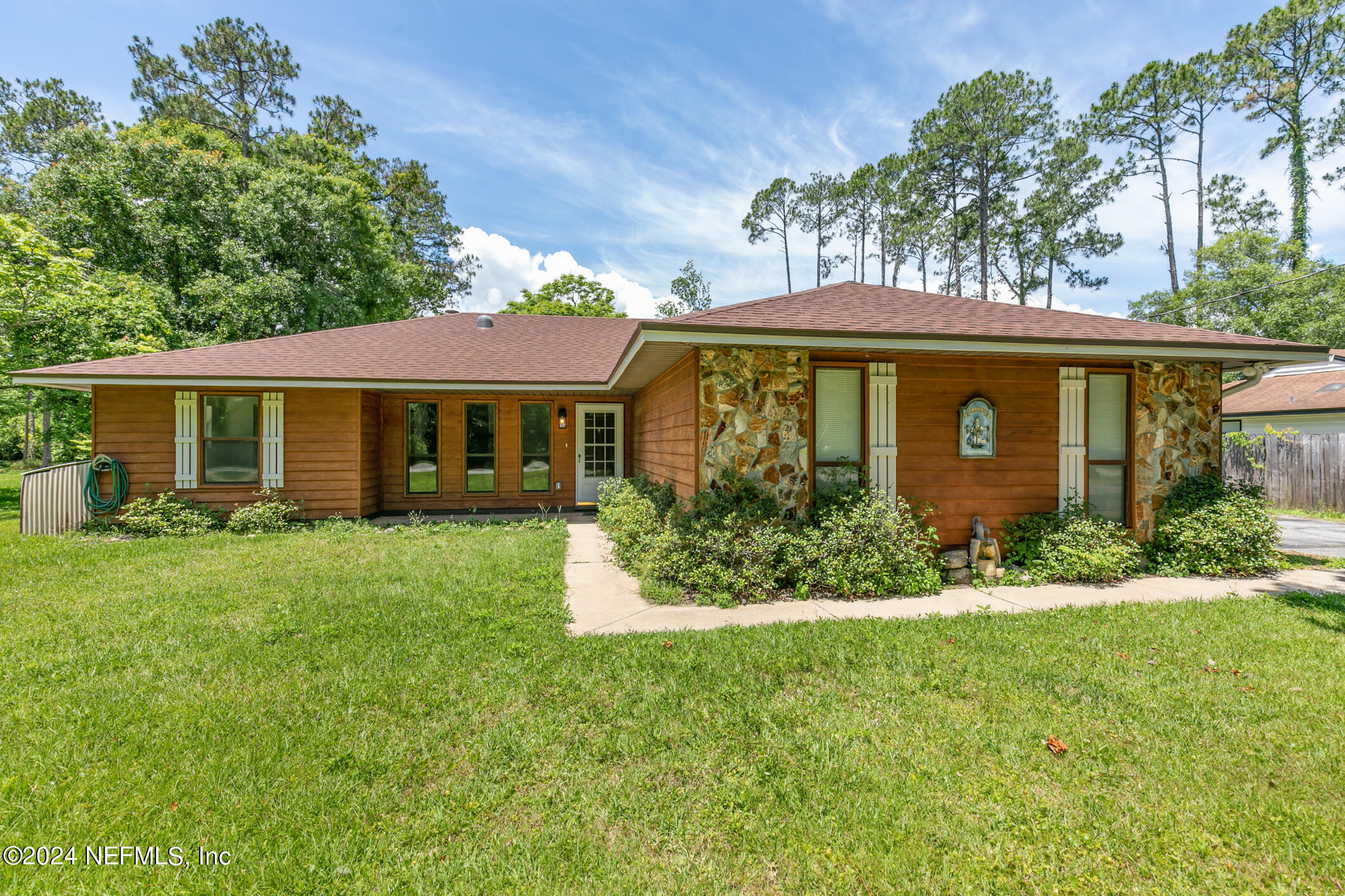 5165 Datil Pepper Road St. Augustine, FL 32086 - Photo 9 of 54 front view of a house with a yard