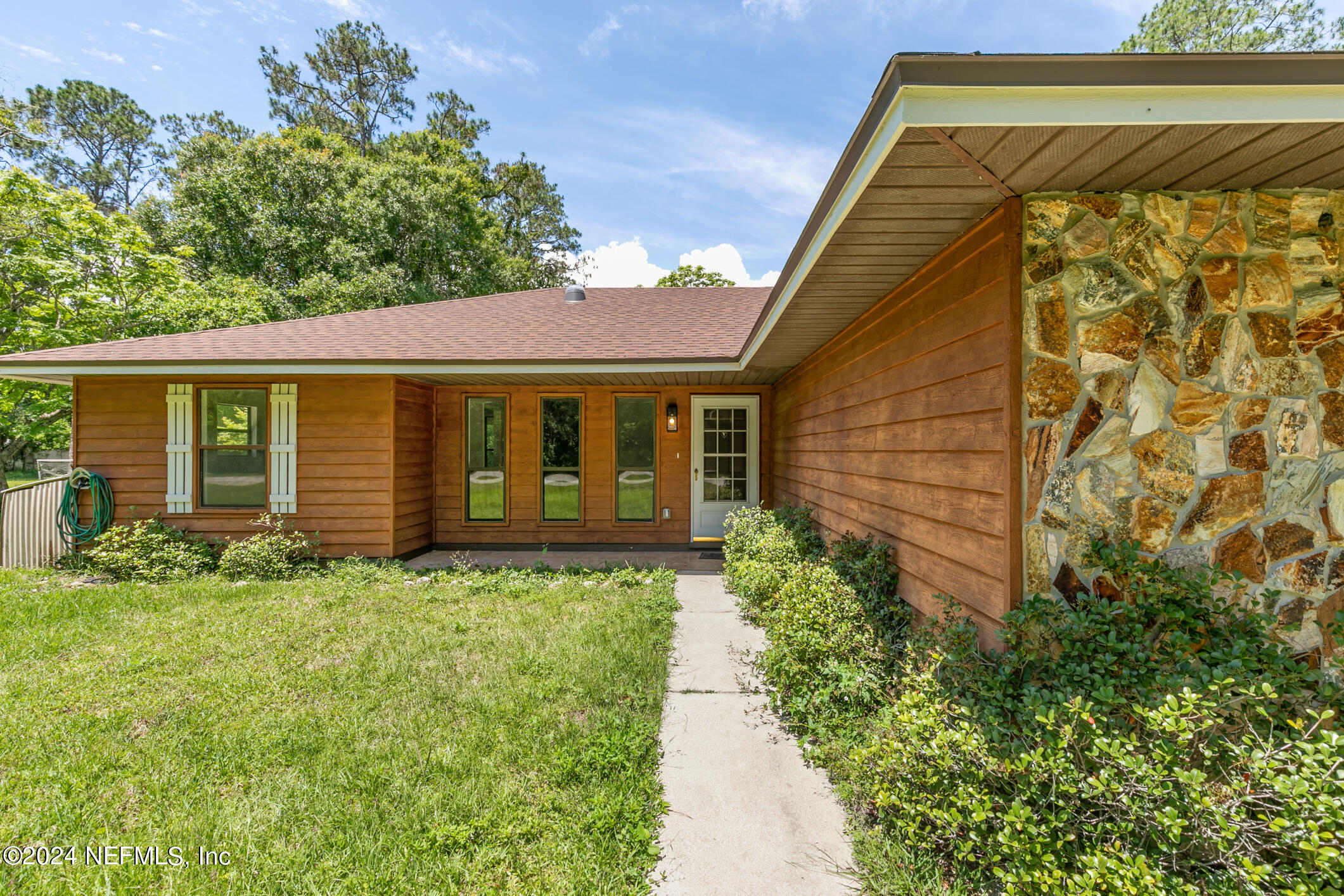 5165 Datil Pepper Road St. Augustine, FL 32086 - Photo 10 of 54 a front view of a house with garden