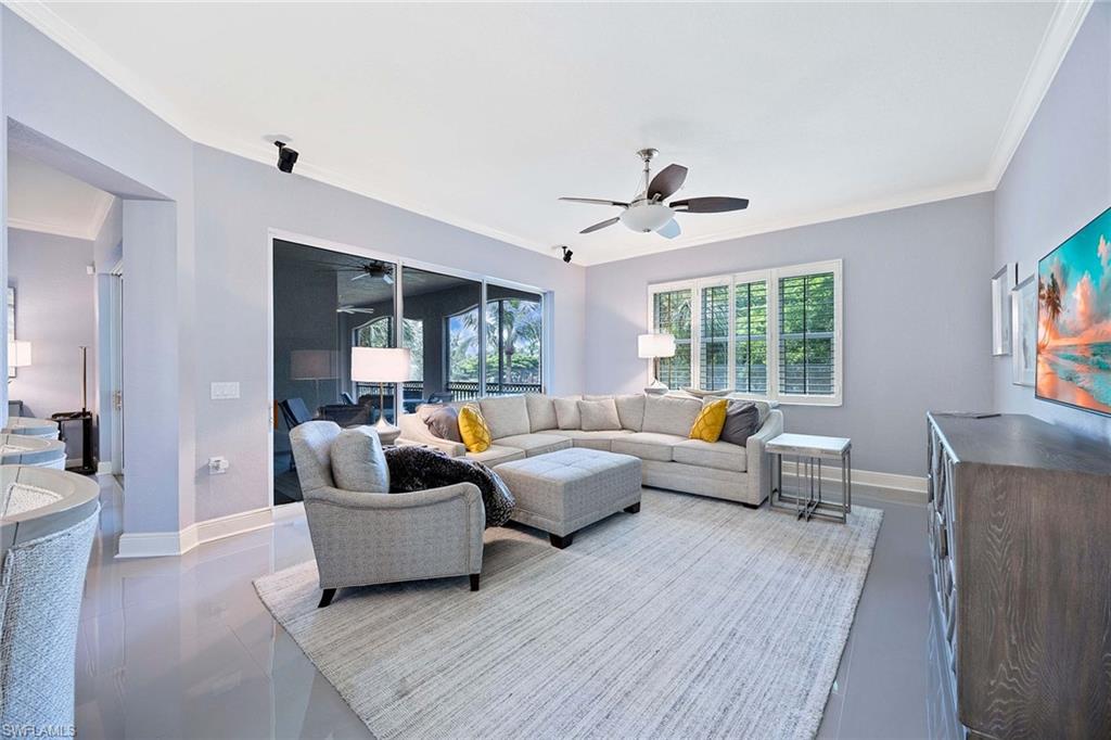 9202 Museo Circle, Unit 204 Naples, FL 34114 - Photo 12 of 37 a living room with furniture and a large window