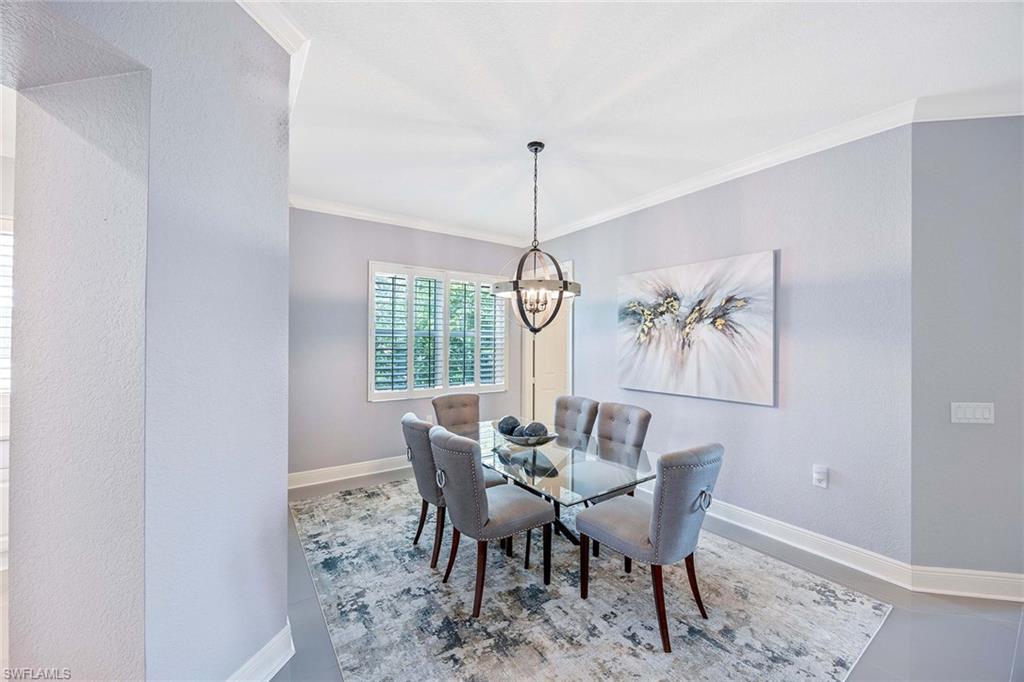 9202 Museo Circle, Unit 204 Naples, FL 34114 - Photo 17 of 37 a view of a dining room with furniture window and outside view