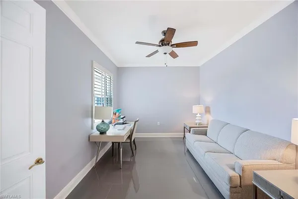 a living room with furniture and a window