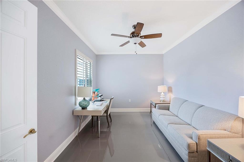 9202 Museo Circle, Unit 204 Naples, FL 34114 - Photo 22 of 37 a living room with furniture and a window