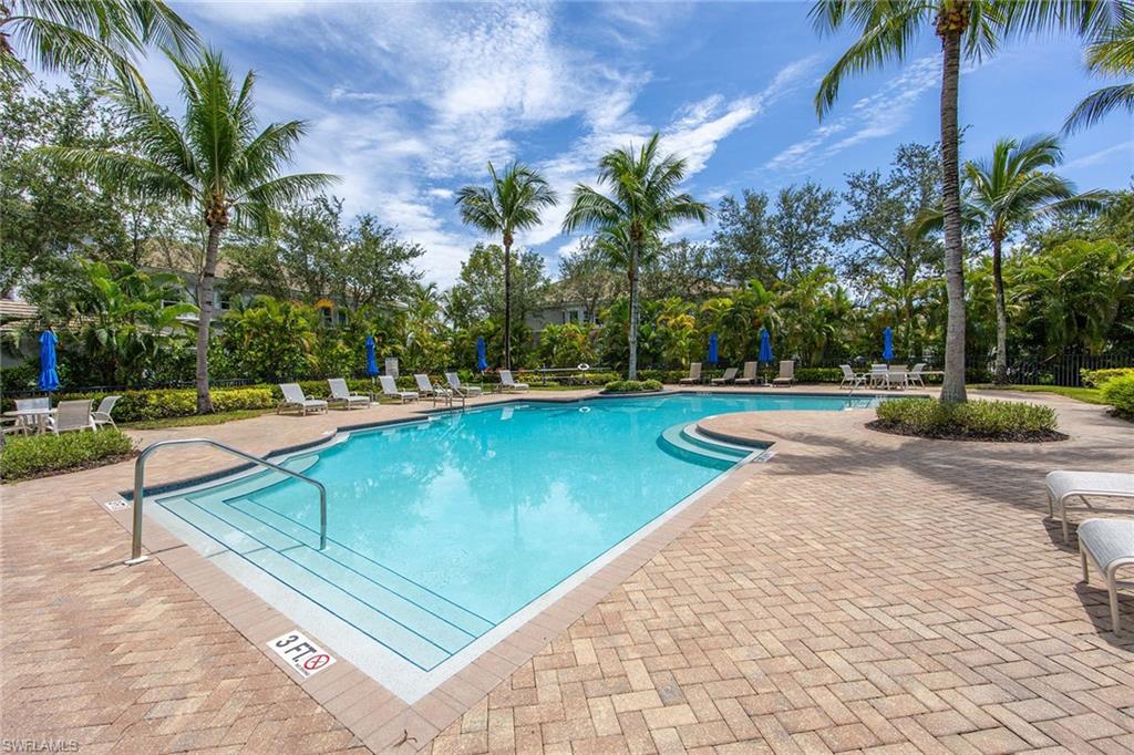 9202 Museo Circle, Unit 204 Naples, FL 34114 - Photo 35 of 37 a view of a swimming pool with a yard