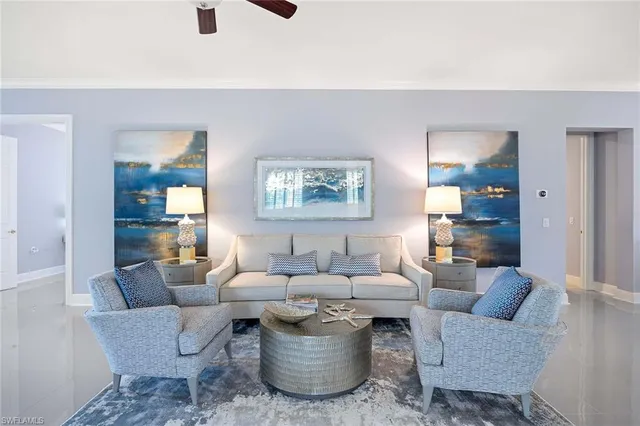 a living room with furniture and a potted plant