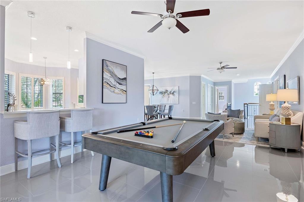 9202 Museo Circle, Unit 204 Naples, FL 34114 - Photo 9 of 37 a living room with furniture and window