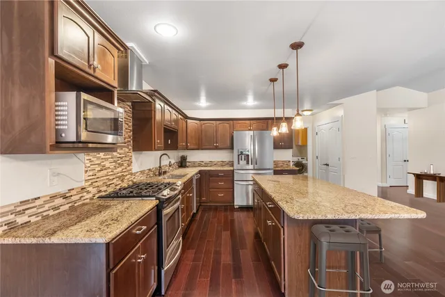 a bedroom with a bed and a lamp