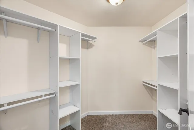 a bathroom with a granite countertop sink a vanity and a mirror