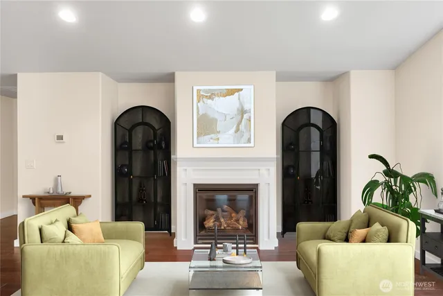 a kitchen with a dining table chairs stove and kitchen island