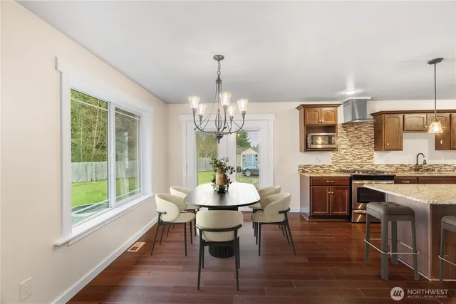 a kitchen with a stove sink and cabinets