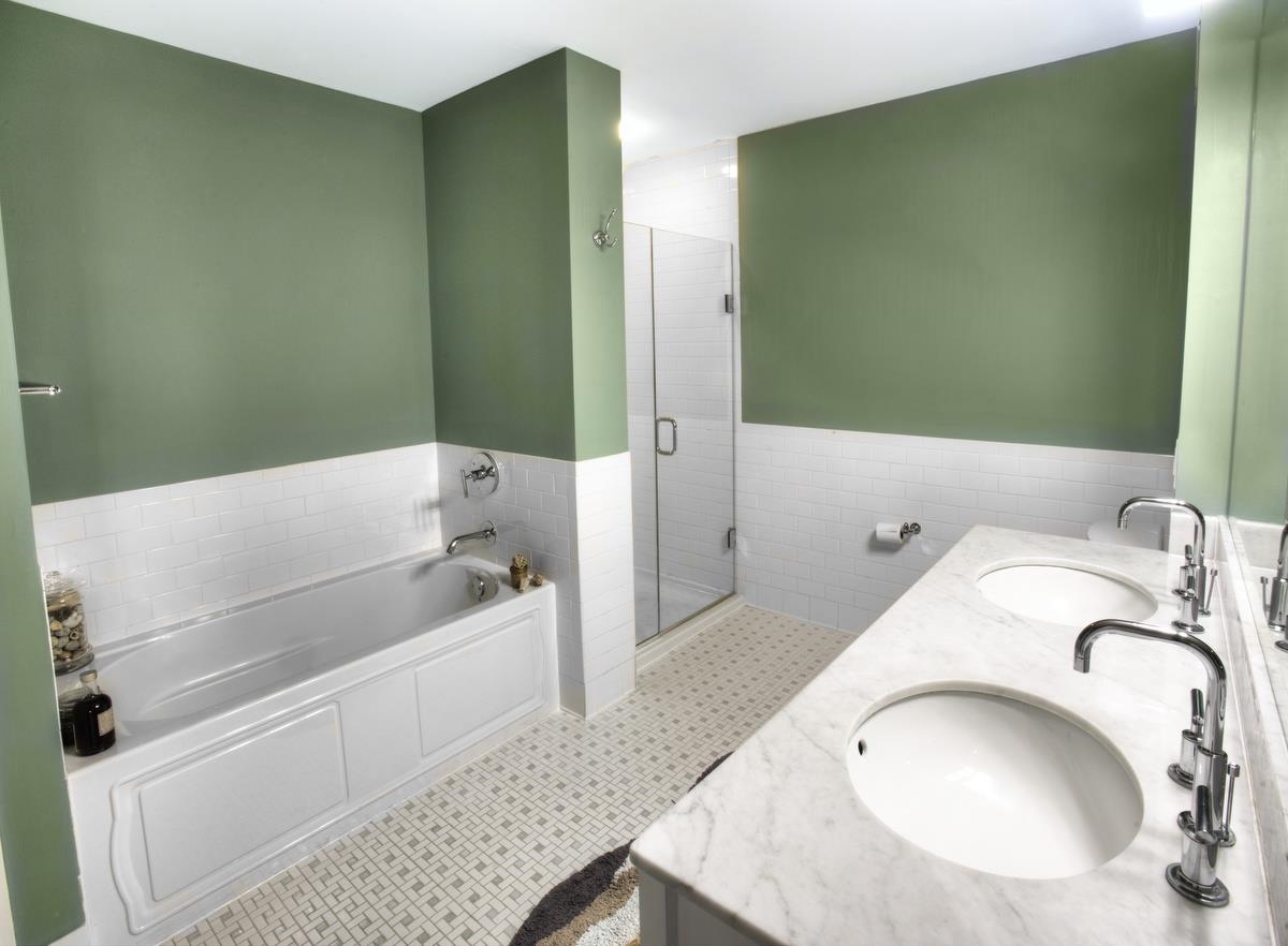 700 Grove Street, Unit 12J Jersey City, NJ 07310 - Photo 8 of 16 a bathroom with a sink and a bathtub