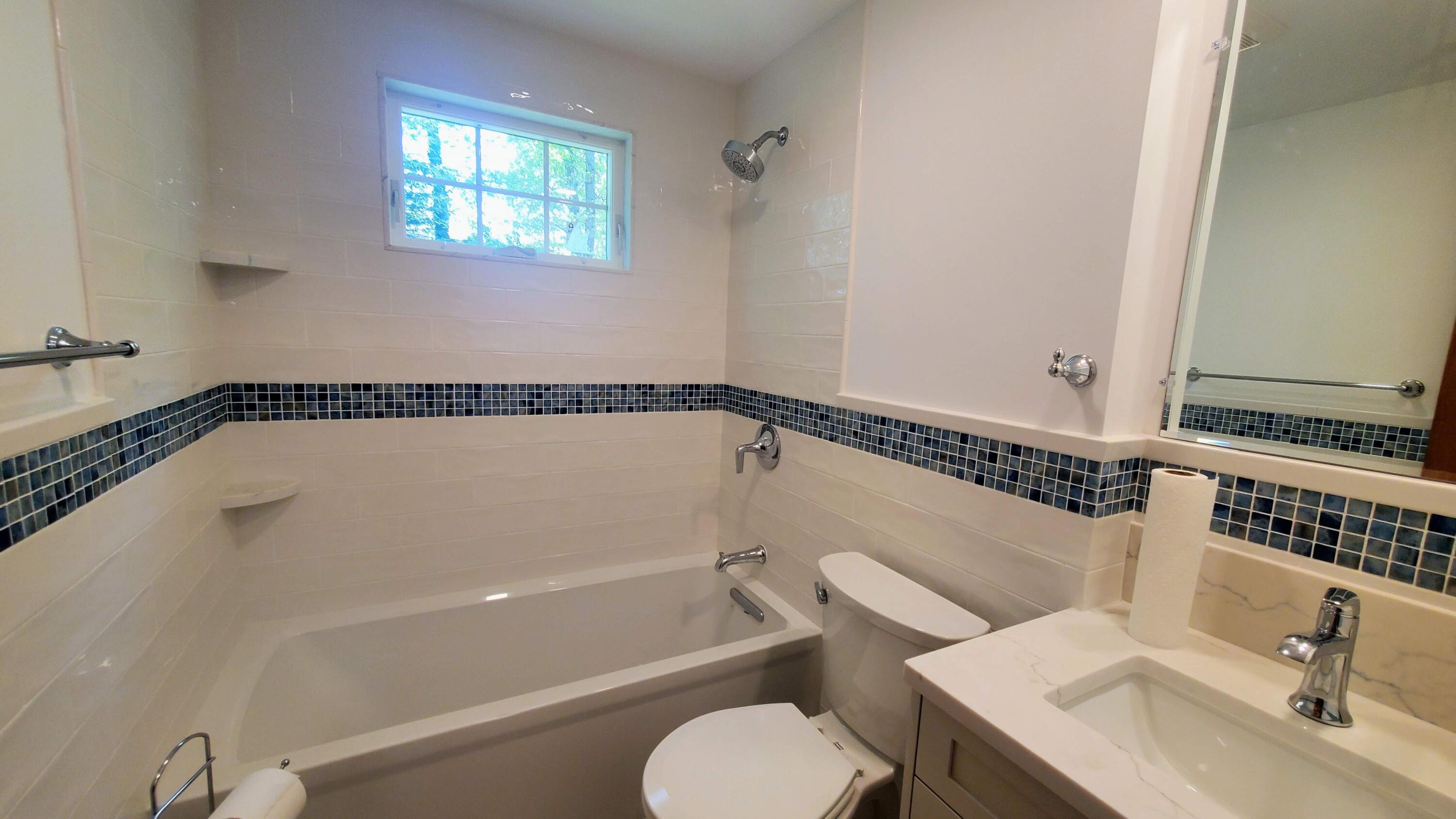 66 Uncle Edwards Road Mashpee, MA 02649 - Photo 18 of 18 a bathroom with a sink and a bathtub