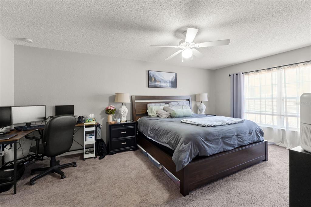 15335 Fleetwood Road Weeki Wachee, FL 34614 - Photo 10 of 40 a spacious bedroom with a bed and a window