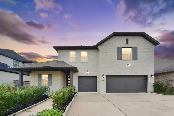 a front view of a house with a garage