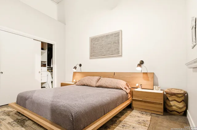 a bedroom with a bed and a couch