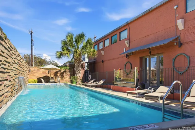 a hallway with sliding door and shower