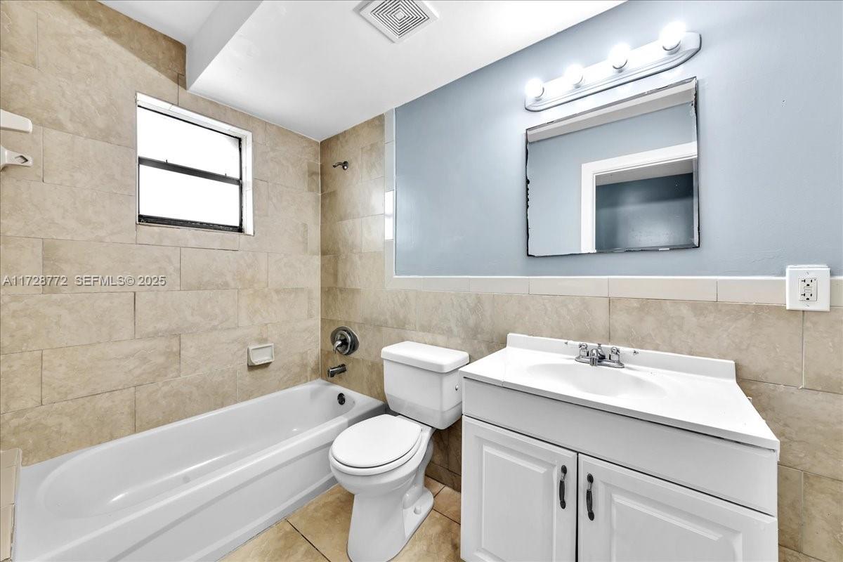 365 Northwest 8th Street, Unit 211 Miami, FL 33136 - Photo 11 of 29 a bathroom with a sink a toilet and shower