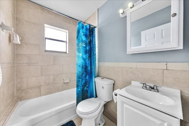 a kitchen with stainless steel appliances granite countertop a refrigerator and a stove