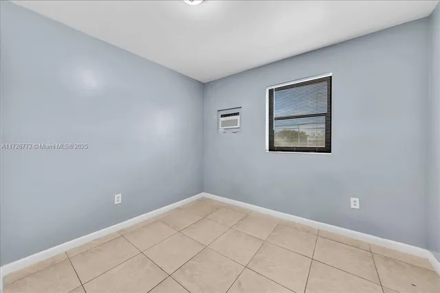 a white toilet sitting next to a bath tub