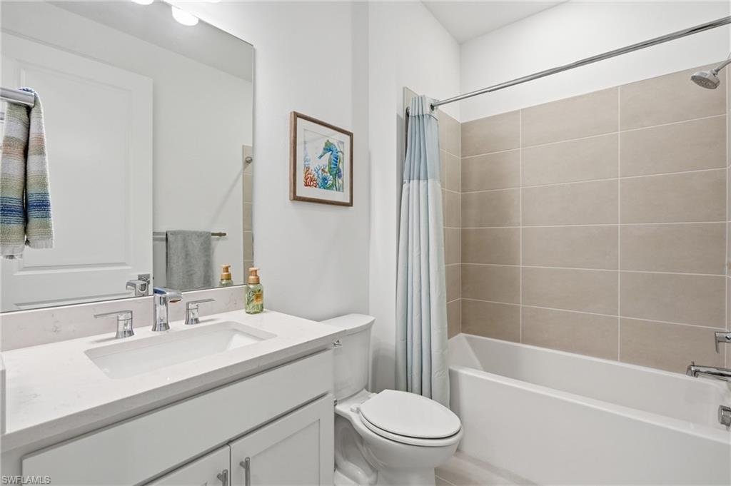 18364 Ridgeline Drive Estero, FL 33928 - Photo 30 of 50 a bathroom with a sink toilet and shower