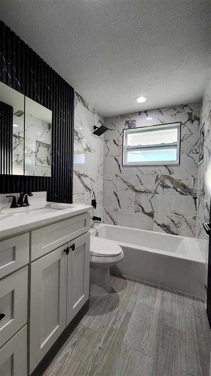 3629 Bedford Street New Port Richey, FL 34652 - Photo 14 of 29 a bathroom with a double vanity sink toilet mirror and bathtub