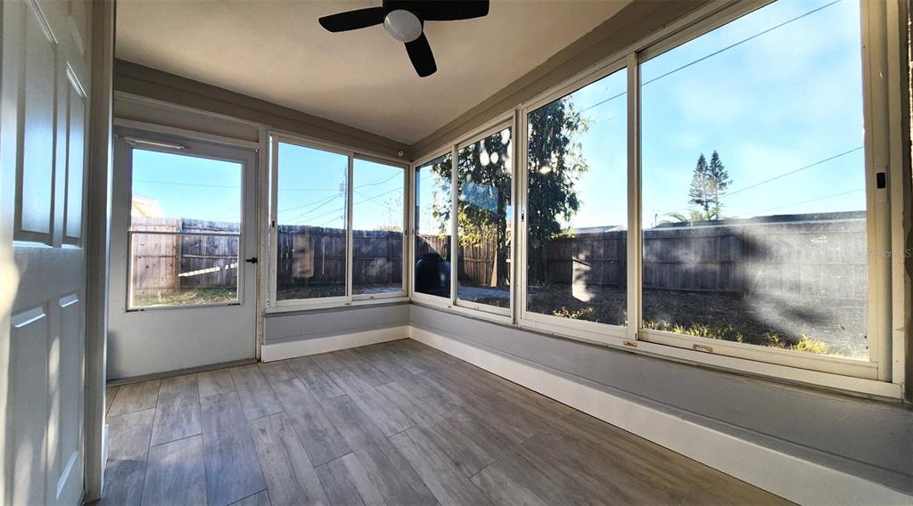 3629 Bedford Street New Port Richey, FL 34652 - Photo 19 of 29 a view of a porch with a floor to ceiling window