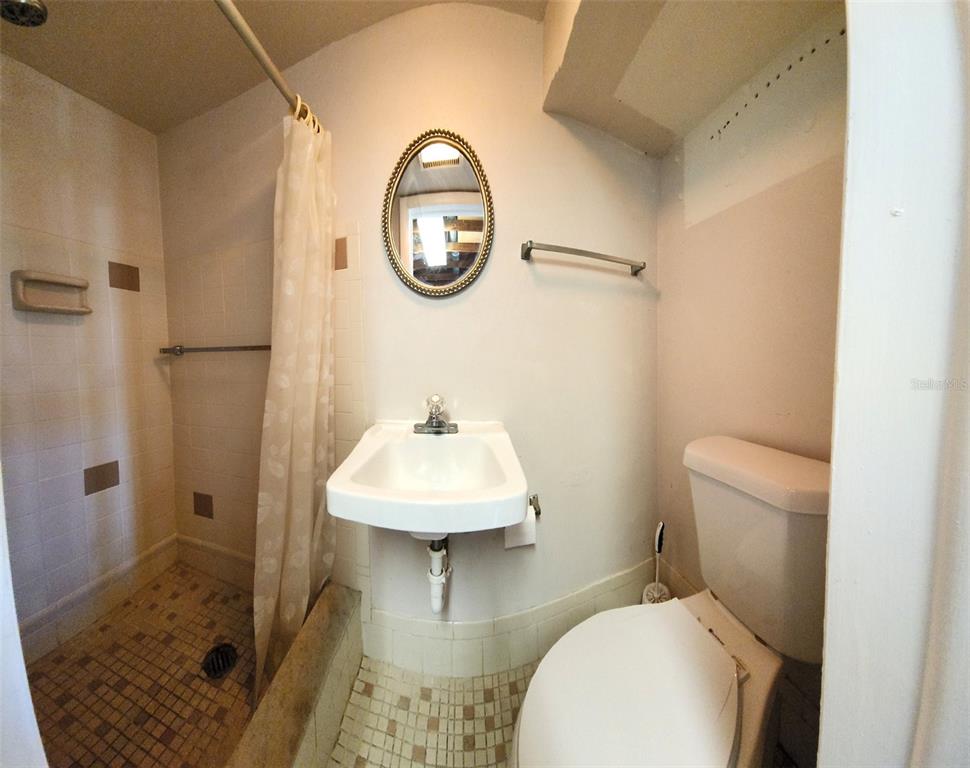 3629 Bedford Street New Port Richey, FL 34652 - Photo 23 of 29 a bathroom with a sink toilet and a shower