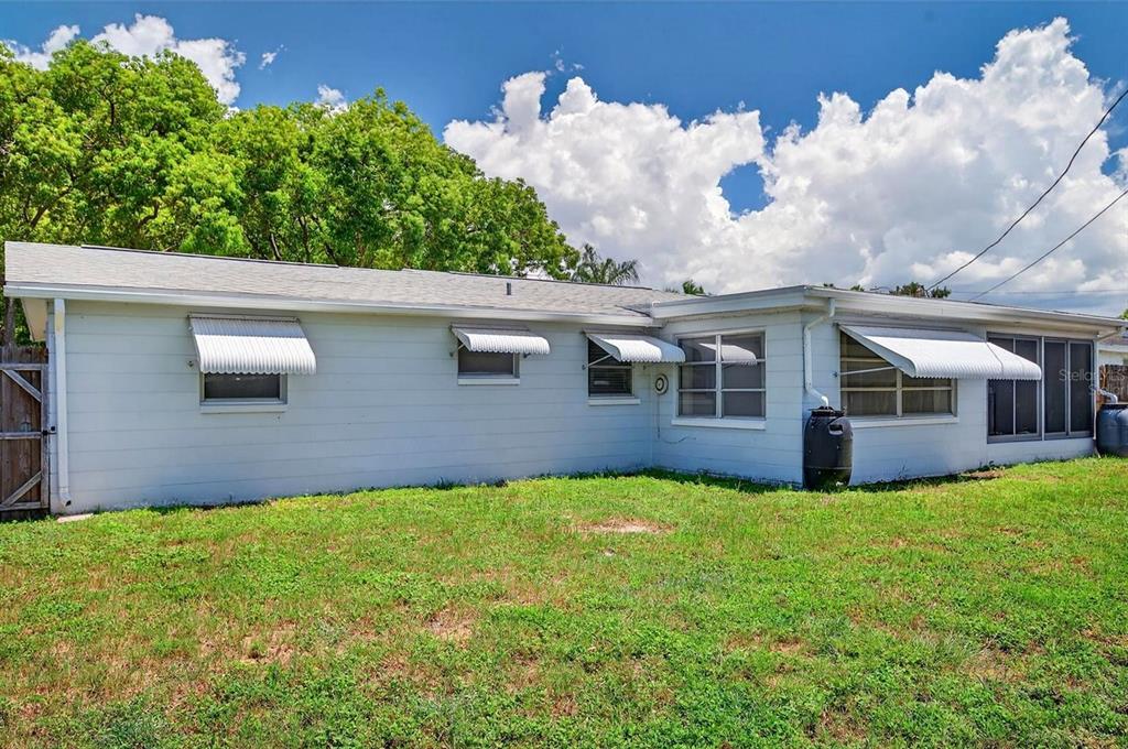 3629 Bedford Street New Port Richey, FL 34652 - Photo 28 of 29 a view of a house with a yard
