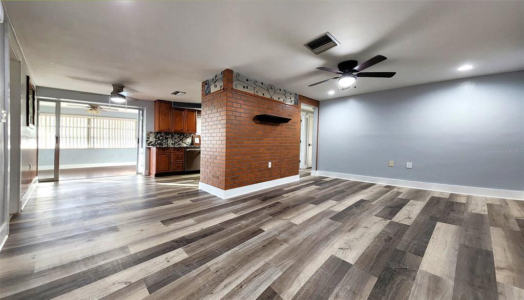 3629 Bedford Street New Port Richey, FL 34652 - Photo 3 of 29 a view of an empty room and wooden floor