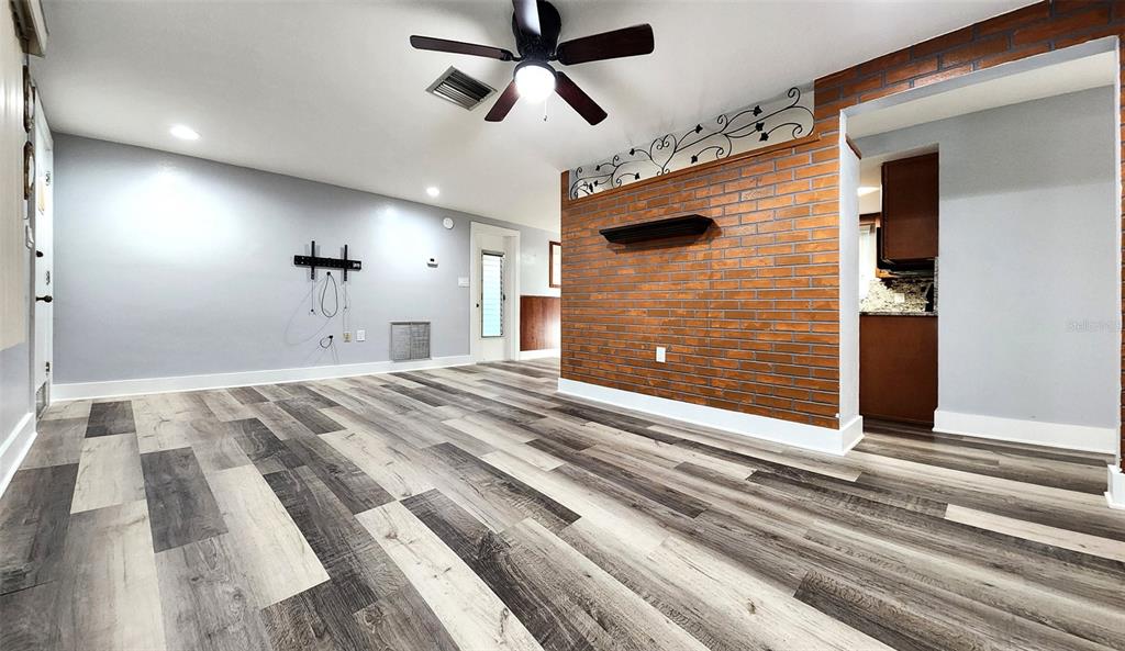 3629 Bedford Street New Port Richey, FL 34652 - Photo 4 of 29 a view of a livingroom with a ceiling fan