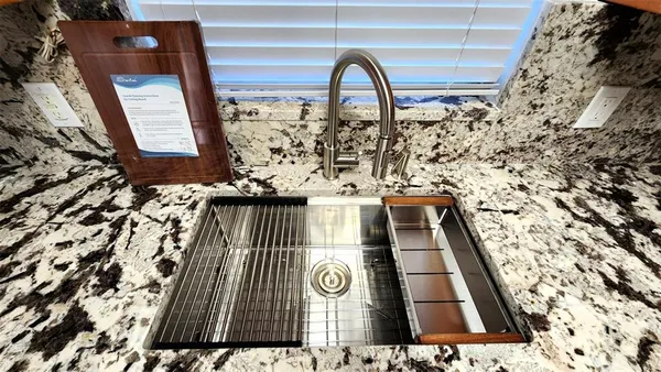 a stove top oven sitting inside of a kitchen