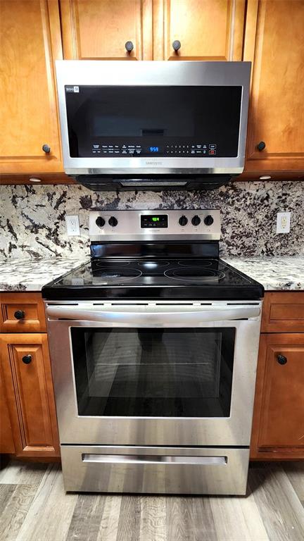 3629 Bedford Street New Port Richey, FL 34652 - Photo 9 of 29 a stove top oven sitting inside of a kitchen