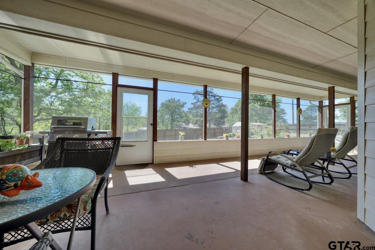 412 Elm Lane Lindale, TX 75771 - Photo 36 of 48 a living room with furniture and floor to ceiling windows