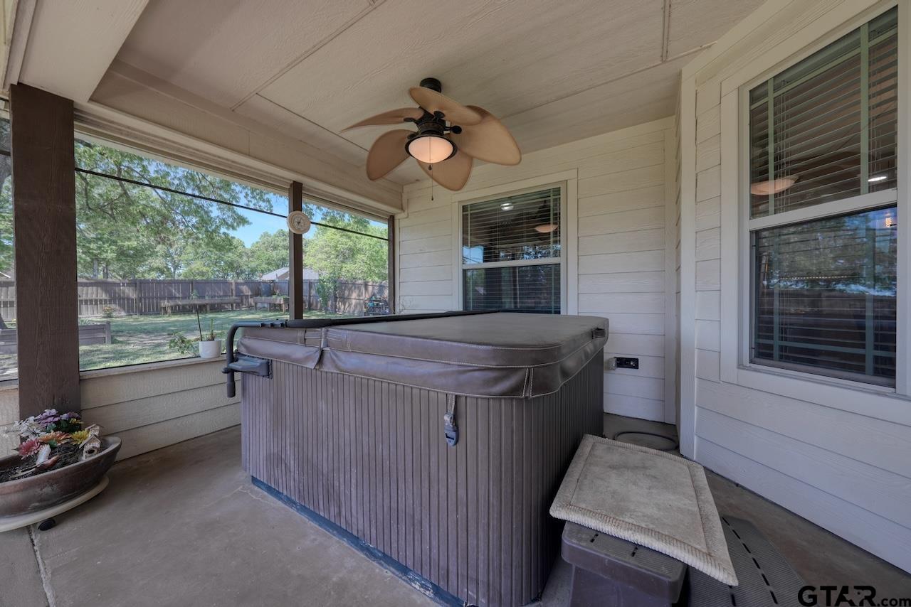 412 Elm Lane Lindale, TX 75771 - Photo 39 of 48 a kitchen with a stove a microwave and furniture