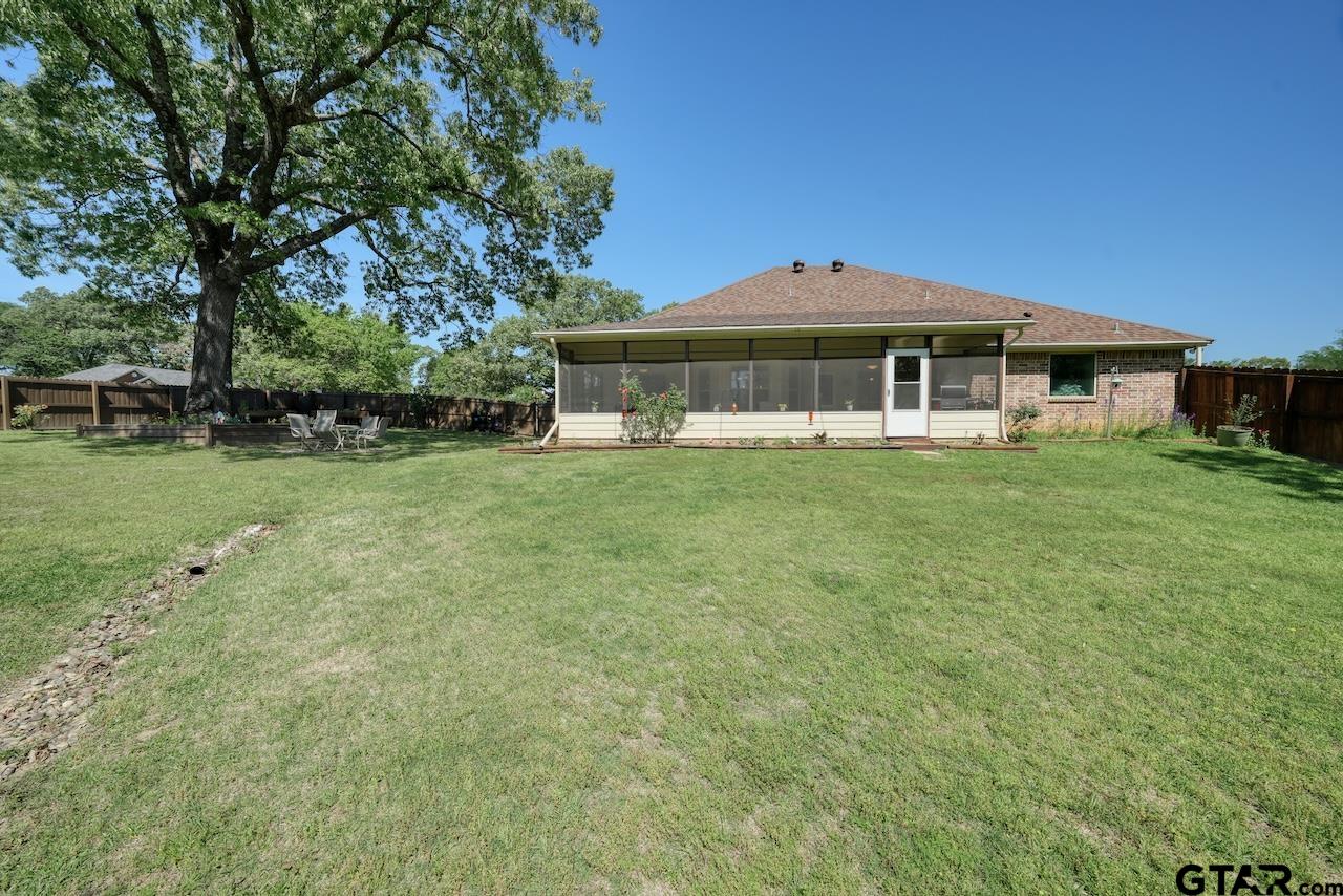 412 Elm Lane Lindale, TX 75771 - Photo 41 of 48 a view of a house with a yard