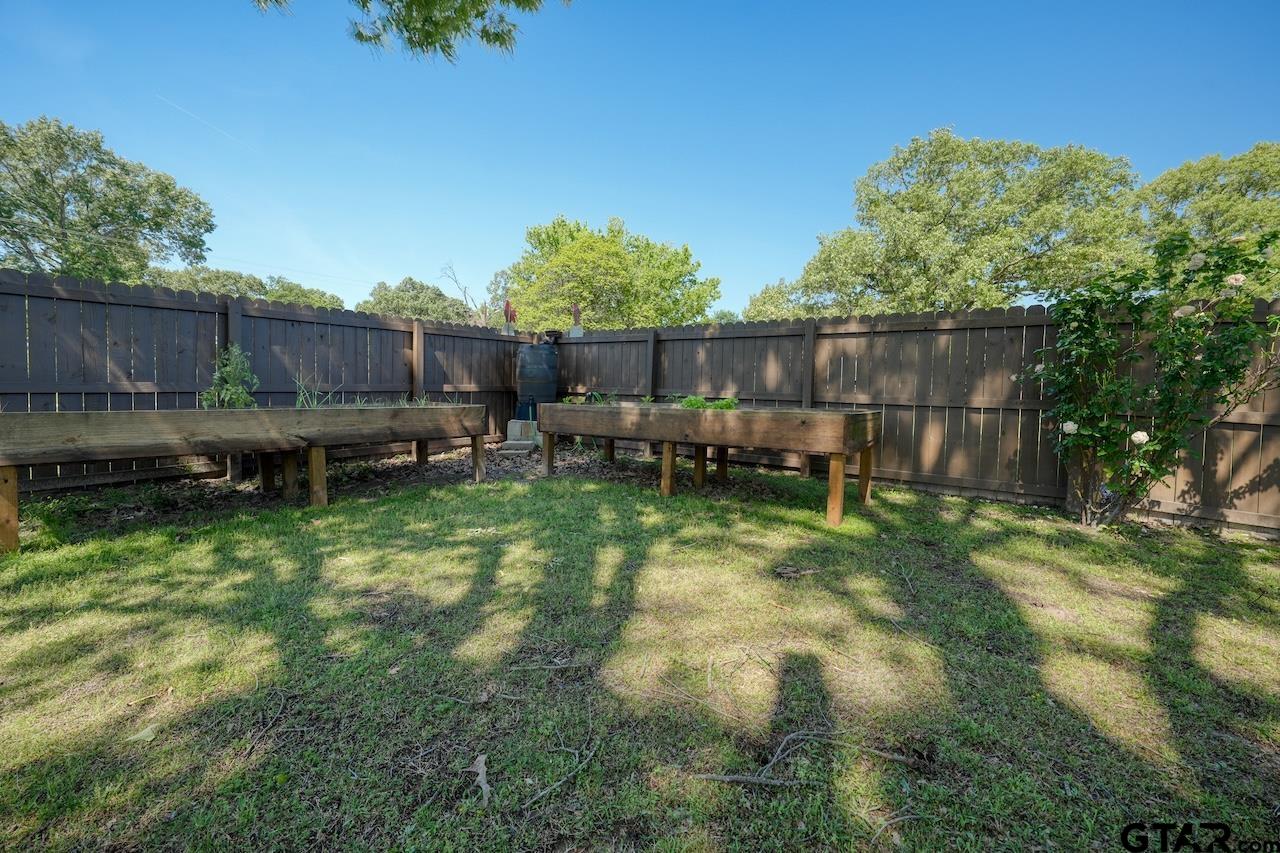 412 Elm Lane Lindale, TX 75771 - Photo 44 of 48 a backyard of a house with lots of green space