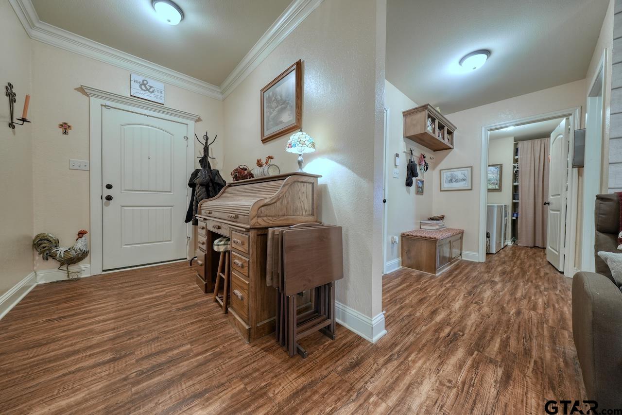 412 Elm Lane Lindale, TX 75771 - Photo 5 of 48 a bedroom with furniture and a wooden floor