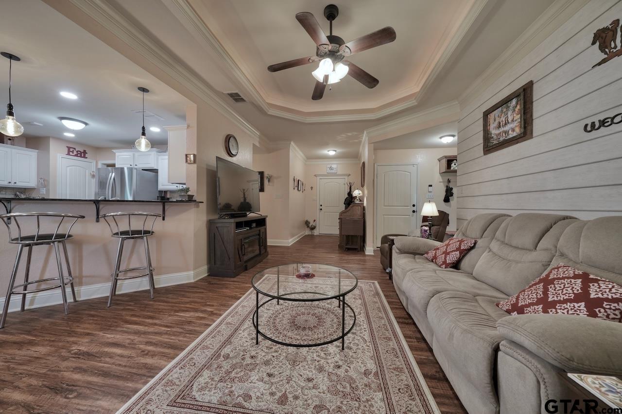 412 Elm Lane Lindale, TX 75771 - Photo 9 of 48 a living room with furniture and a view of kitchen