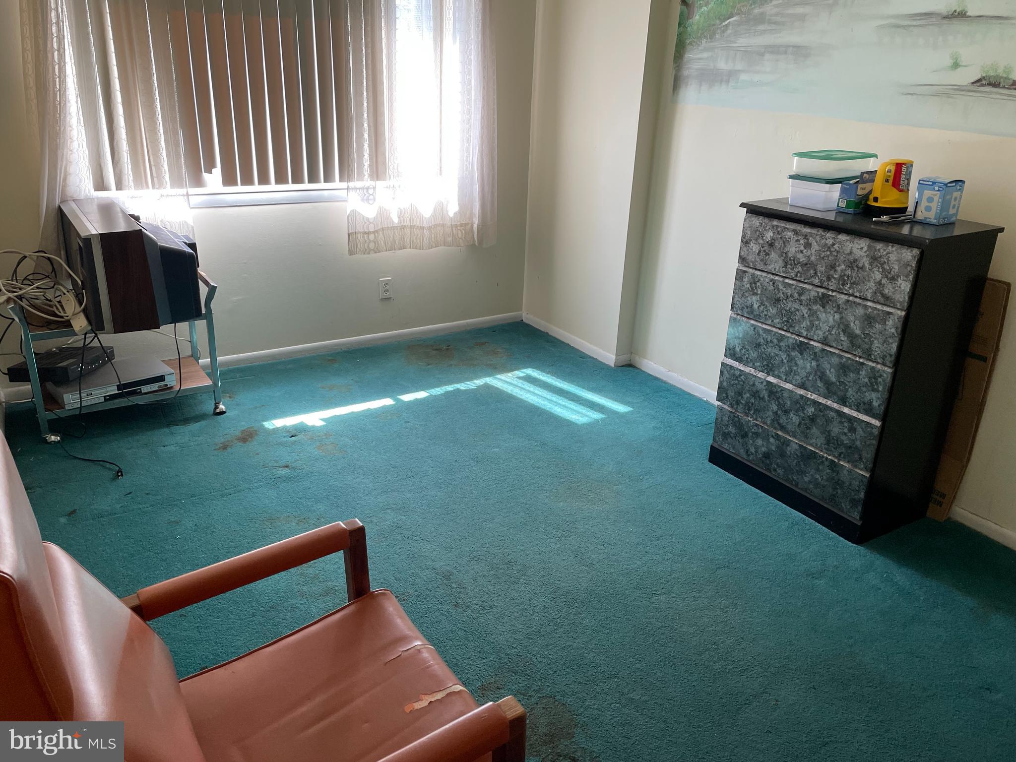 3156 Apple Road Northeast, Unit 18 Washington, DC 20018 - Photo 11 of 16 a room with furniture and a window