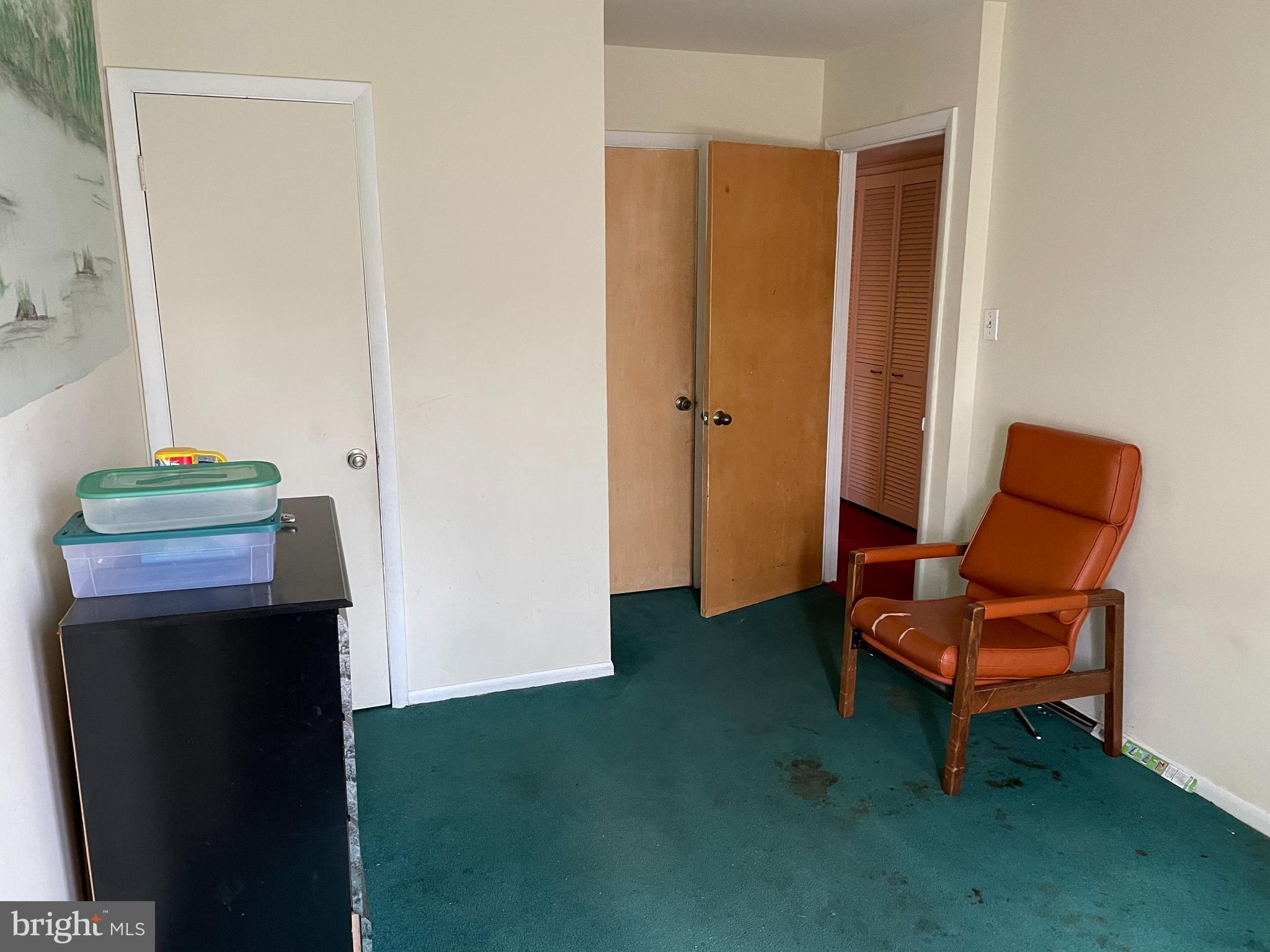 3156 Apple Road Northeast, Unit 18 Washington, DC 20018 - Photo 12 of 16 a living room with furniture and a chair