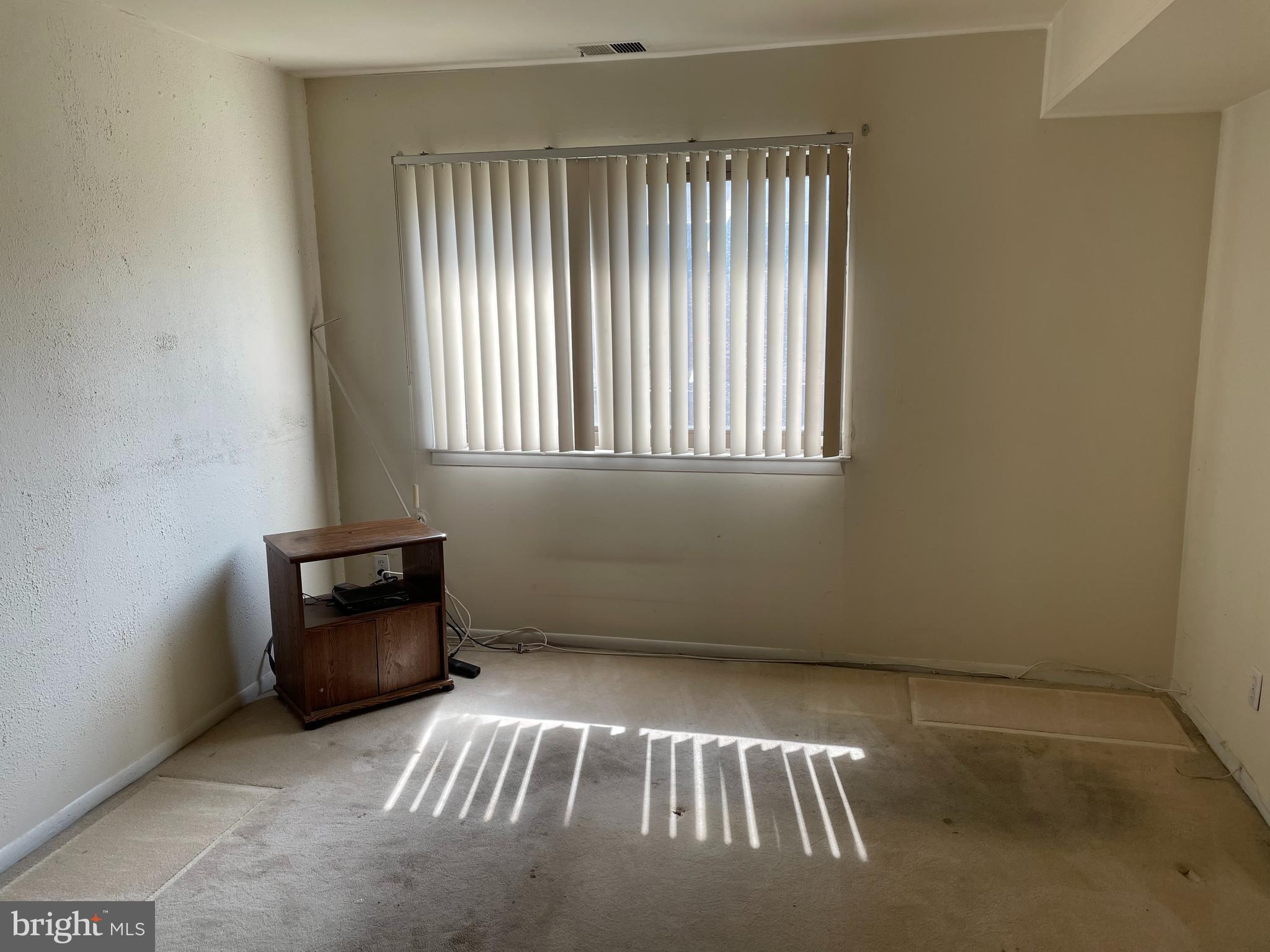 3156 Apple Road Northeast, Unit 18 Washington, DC 20018 - Photo 13 of 16 an empty room with windows