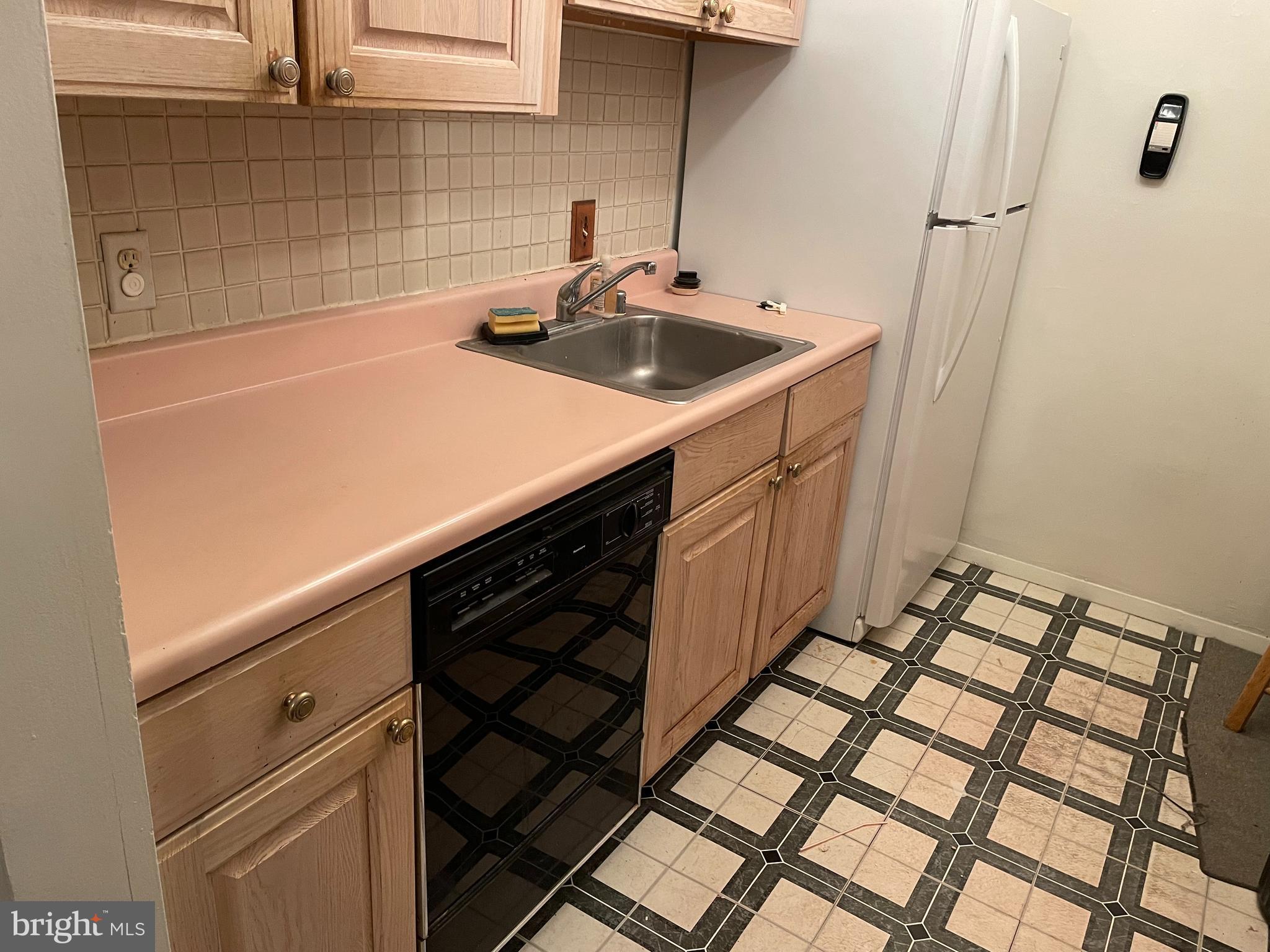 3156 Apple Road Northeast, Unit 18 Washington, DC 20018 - Photo 7 of 16 a kitchen with a sink and cabinets