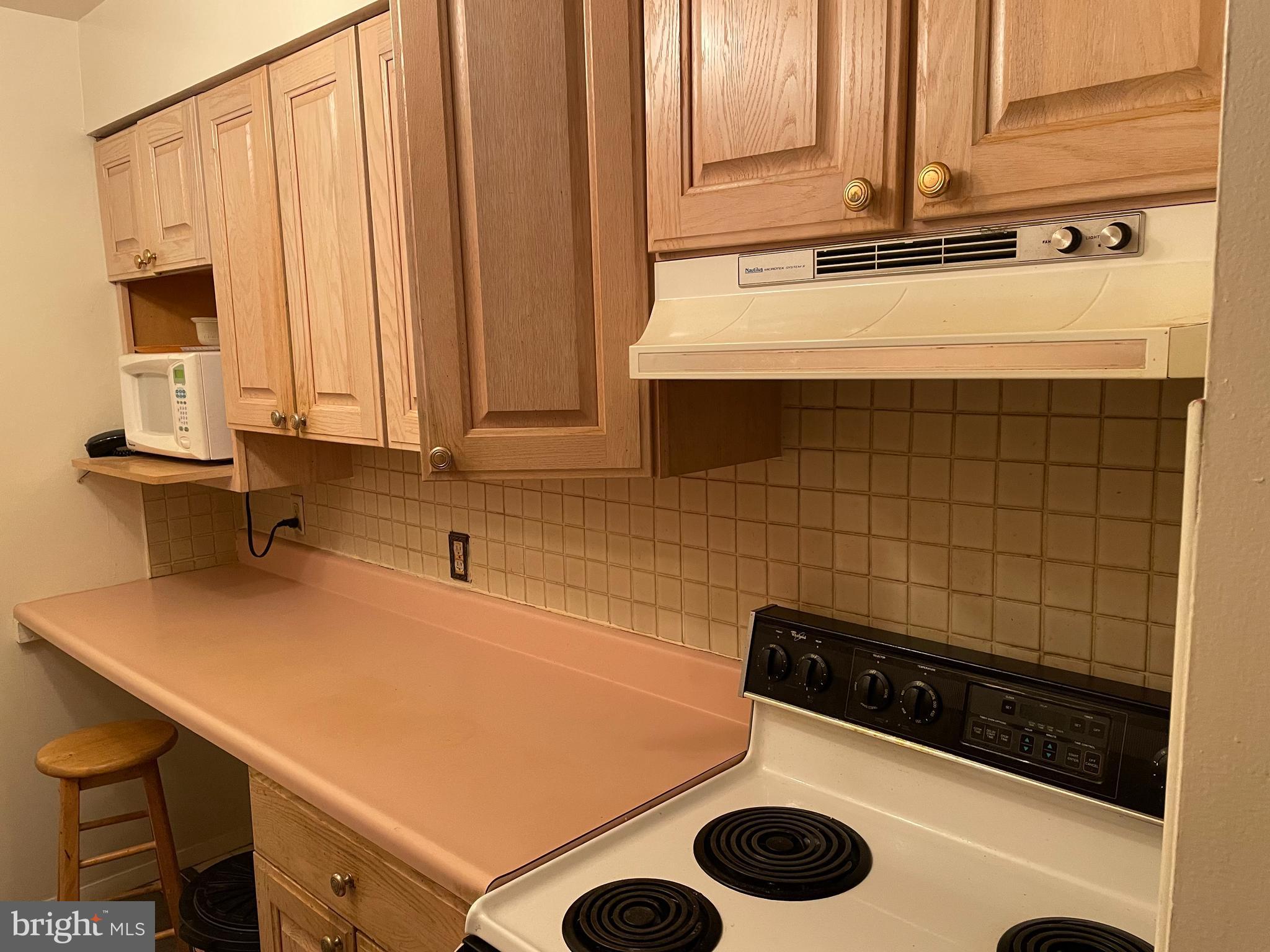 3156 Apple Road Northeast, Unit 18 Washington, DC 20018 - Photo 8 of 16 a kitchen with a sink and a stove