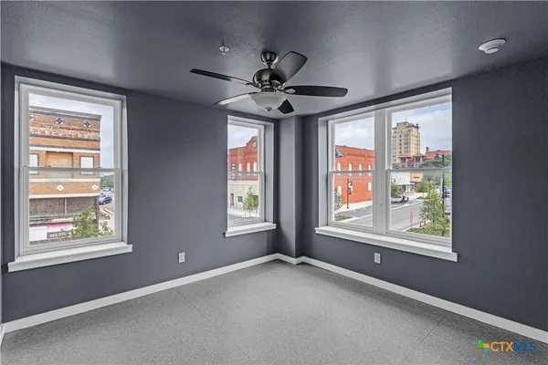 a view of an empty room with a window