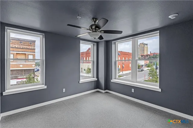 a view of an empty room with a window