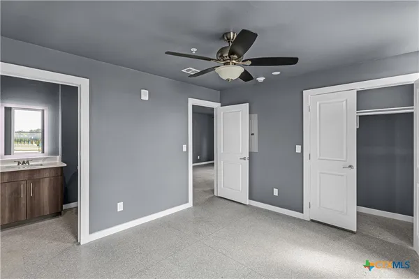 a view of an empty room with closet area