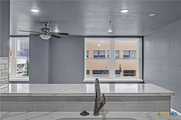 a view of entryway and hall with a window