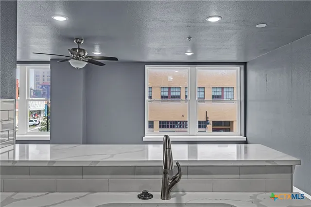 a view of entryway and hall with a window