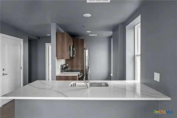 a bathroom with a bathtub and a sink