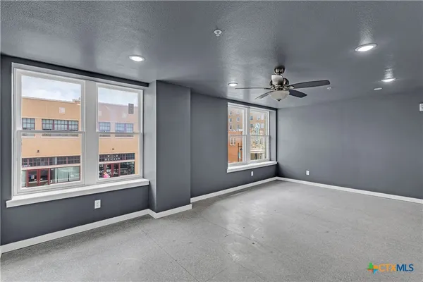 a view of an empty room with a window