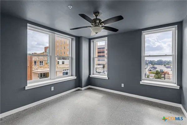 a view of an empty room with a window